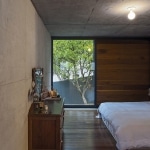 Chambre avec murs et plafond beton